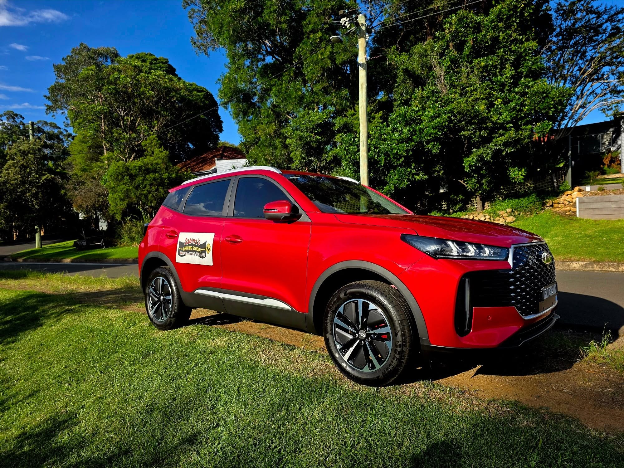 Sabina's Driving School red training car